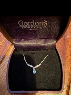 Gordon's Jewelers aquamarine and diamond white gold necklace.